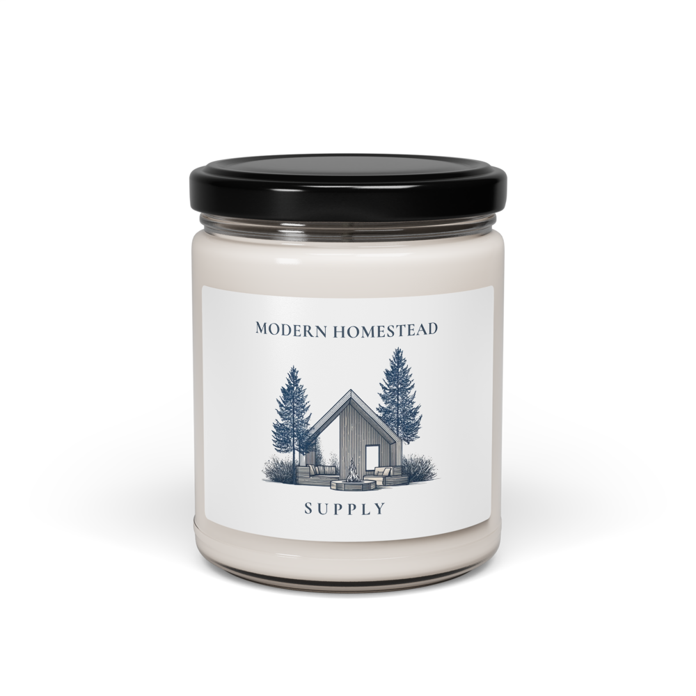 Candle jar with a label featuring a cabin and trees on a white background