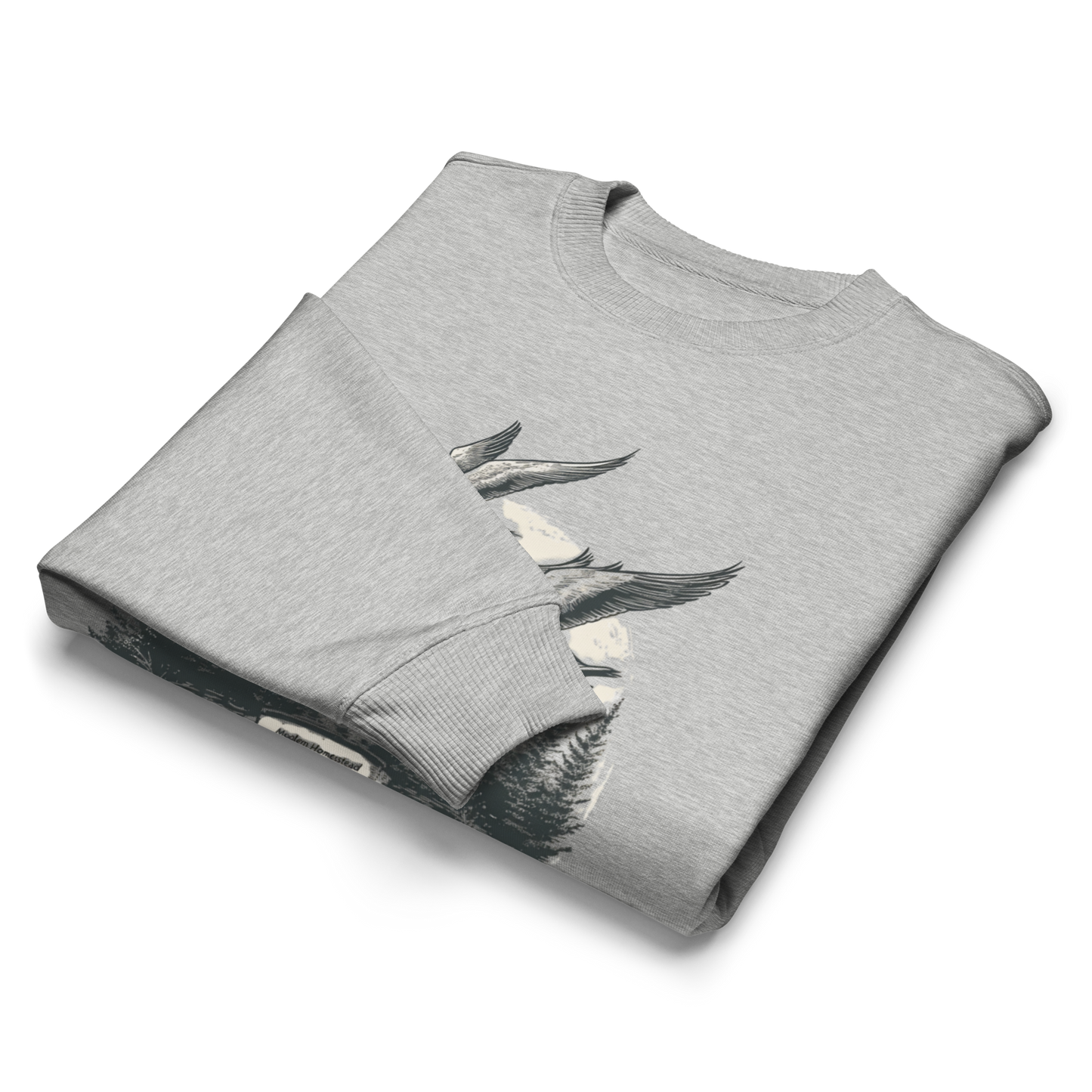Folded gray sweatshirt with a graphic design on a white background