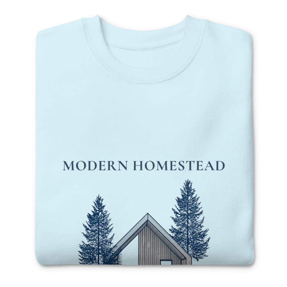 Light blue sweatshirt with 'Modern Homestead' text and cabin design on a white background